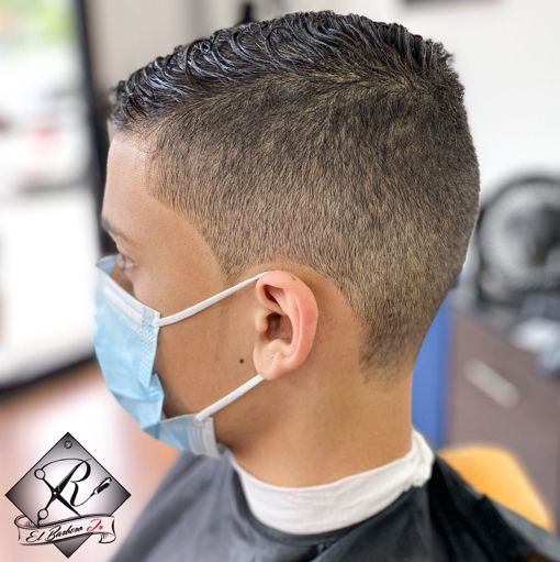 Youth haircut with a clean temple fade