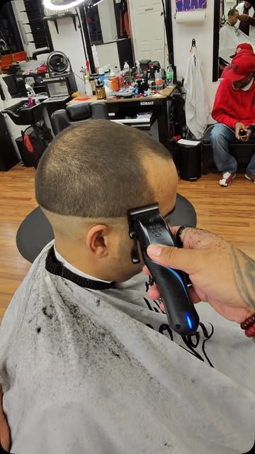 Close-up clipper work on a sharp fade